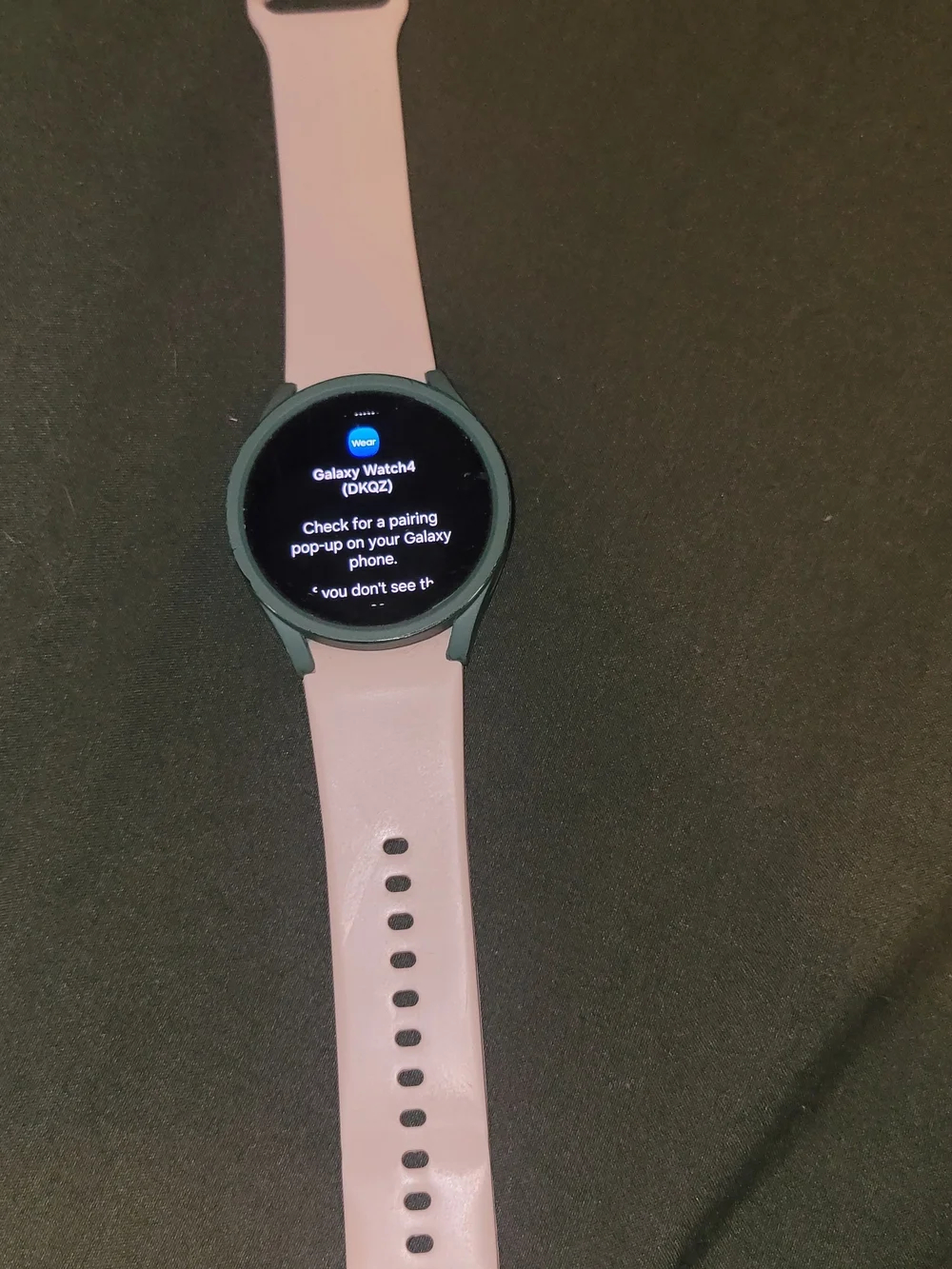 Samsung Galaxy Watch4 with Light Pink Silicone Band and Dark Green Case